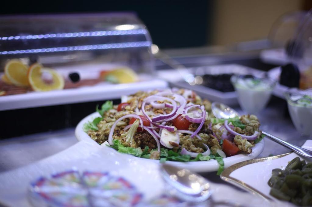 Holiday Suites Al Azizia Mecca Exterior photo A plate of tabouleh salad